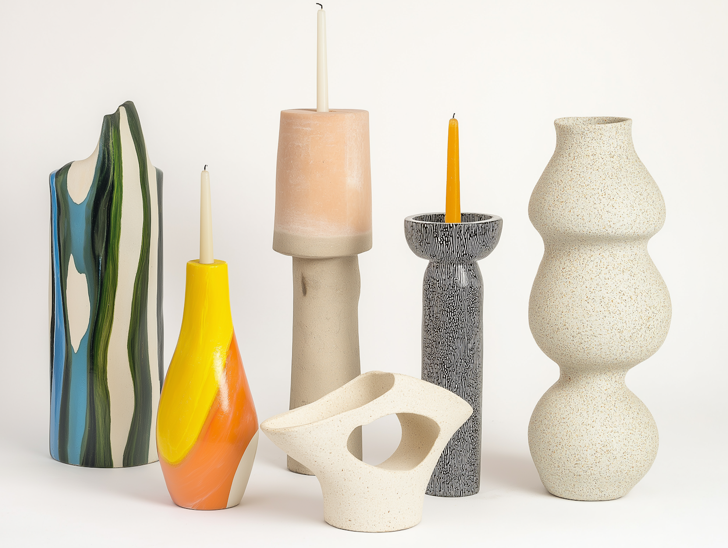 Six sculptural vases and candle holders in blue, green, yellow, peach, black and speckled white